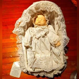 Vintage 1989 Artmark musical porcelain doll & bassinet really cute! 35 years old